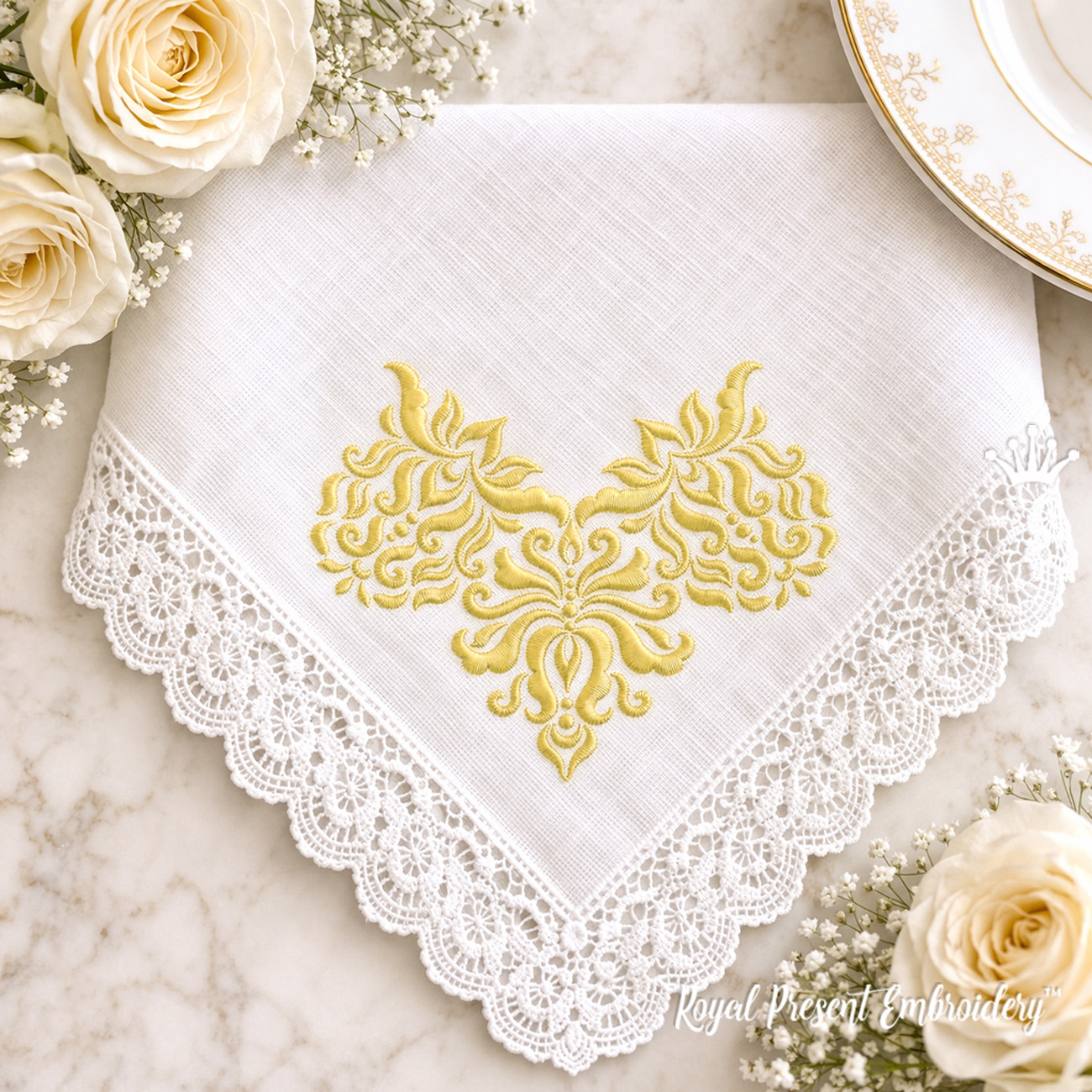 White linen handkerchief with white-on-white machine embroidery corner design
